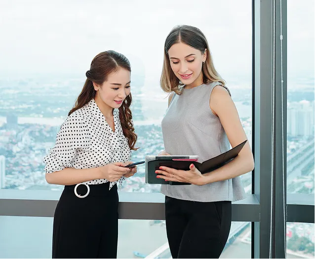 coworkers-discussing-report-digital-tablet 2.png